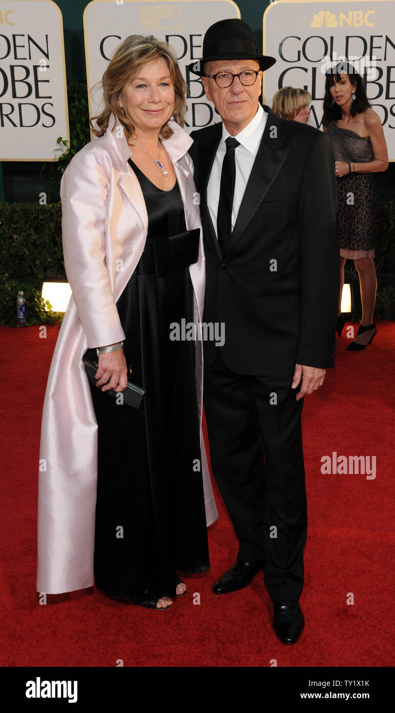 Actor Geoffrey Rush and his wife Jane Menelaus arrive at the 68th
